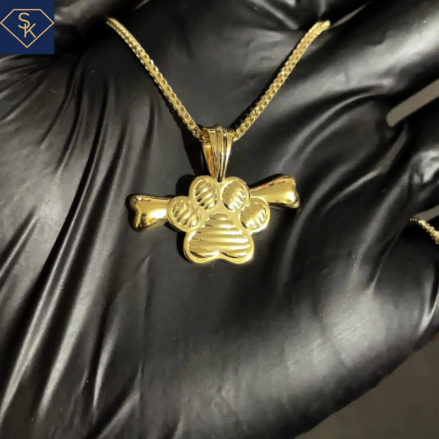 Dog Paw With Bone Pendant